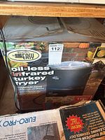 Photo showing the Char-Broil The Big Easy oil-less infrared turkey fryer in its original box with label and branding visible.