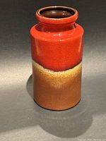 Full side view of Scheurich West German ceramic vase showing red to tan gradient glaze.