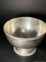 Full view of the vintage silver cup showing shape, size and general condition.