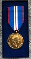 Front side of the Queen Elizabeth II commemorative medal showing the profile of the Queen along with inscriptions related to Canada.