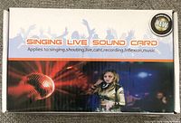 Front of box labeled 'SINGING LIVE SOUND CARD' with image of a microphone and DJ.