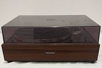 Front view of the Pioneer turntable with the dust cover put on showing wood finish and Pioneer logo.