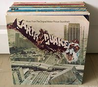 Front view of Earthquake soundtrack album cover showing a city collapse theme