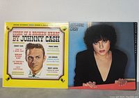 Photo of the fronts of Johnny Cash 'Story of a Broken Heart' and Rosanne Cash 'Seven Year Ache' vinyl album covers side by side.