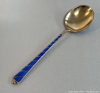 Image showing the front of the small spoon with blue enamel handle and silver bowl.