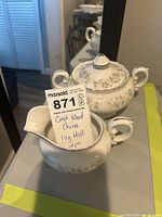 Two-piece Crestwood China sugar and creamer set in Ivy Mist pattern, showing floral designs and ornate handles.