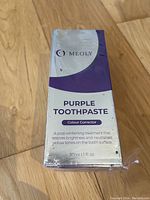 Box of Meoly Purple Toothpaste in unopened packaging