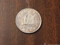 Close-up photo of the coin's reverse side showing the Bluenose schooner and date 1949.