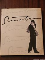 Front cover of the hardcover book titled 'Sinatra' by Ray Coleman, showing Frank Sinatra tipping his hat.