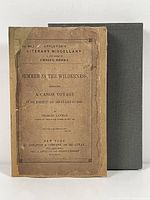 Front cover of the softcover book showing original title and publisher information, with visible age wear and a protective rebound cover behind.