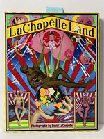 Front cover of LaChapelle Land photobook showing full colorful artwork with figures and globe.