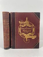 Two leather bound volumes of The Story of Upper Canadian Rebellion by John Charles Dent, showing front covers and spines.