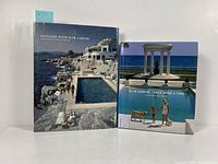 Front view of both Slim Aarons photography books with colorful dust jackets depicting poolside scenes.
