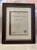 Front view of wooden photo frame The Buckingham Collection with label visible showing 17 x 14 outer size, 8 x 10 photo opening, moulding from England