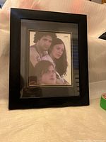 Front view of black wooden photo frame, showing placeholder photo behind glass with double mat.