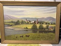Frontal view of oil painting showing village, river, cows, hills, and mountains.