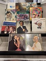 Vinyl records collection with various artists and album covers in good condition.