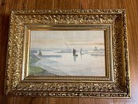 Frontal image of the entire framed antique watercolour painting showing a harbor scene with boats.