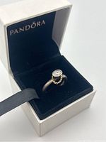 Pandora sterling silver ring with oval clear stone and gold twisted wire detail inside original Pandora box.