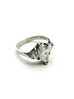 Front and angled view showing marquise crystal centerpiece and two triangular side crystals on sterling silver band.