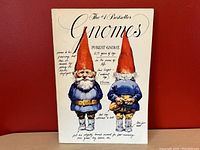 Front cover featuring two illustrated gnomes with handwritten styled notes about forest gnomes.