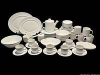 Full set arranged showing plates, bowls, cups, saucers and serving pieces