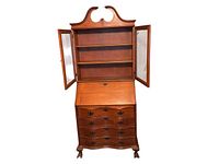 The secretary desk and library cabinet with the two glass doors open revealing shelves inside, drop-down desk open with inner compartments and drawers below.