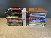 Front view of the lot showing stacks of DVD and Blu-ray cases with visible titles.