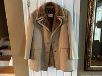 Full view of a vintage men's Mac-Mor coat in beige/tan with a plush Borg fabric interior lining, button closure, and front pockets.