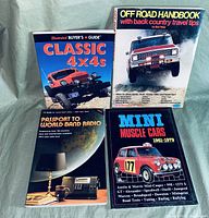Books arranged in a group showing titles and covers including Classic 4x4s, Off Road Handbook, Passport to World Band Radio, and Mini Muscle Cars 1961-1979.