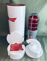 Budweiser Red Light with original cardboard tube packaging, styrofoam inserts, and instruction card