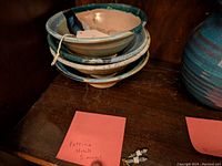 Four stacked ceramic cereal bowls featuring earthy landscape glaze patterns by Patricia Uchill Simons.