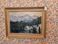 Full view of framed painting against patterned wallpaper