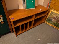 Full view of the vintage teak media storage stand showing overall structure and finish.