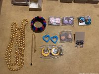 Full view of costume jewelry set with all items arranged on table.