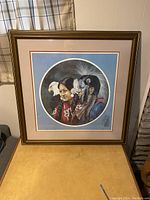 Full framed Eagle Spirit print by Eddie Lepage on a table, showing the entire artwork and frame.