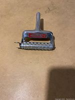 Front side image of the Townsend Fish Skinner tool showing overall shape and handle.