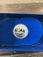 Obverse side of the silver coin showing Avro Canada CF-100 Canuck design with gold accent and denomination.