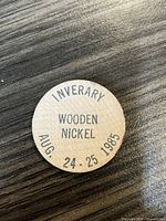 Front face of Inverary wooden nickel showing date August 24-25, 1985