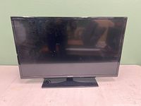 Front view of Samsung 32-inch LED TV showing screen and base stand.