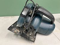 Black & Decker 6.5" corded circular saw front angle showing base plate and handle with power cord.