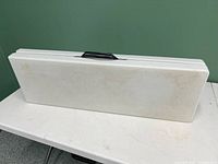 Folded tabletop with carry handle visible