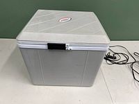 Closed view of the insulated cooler heater showing size and latch on front.