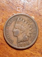 Close-up photo of obverse side of the 1904 US Indian Head Penny showing the Indian head with feathered headdress and the date 1904.