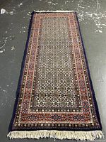 Full view of runner rug laid flat on concrete floor
