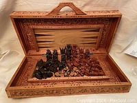 Full view of chessboard open with chess and checkers pieces inside