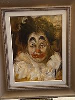 Front view of the framed original oil on board painting showing the sad-faced clown with dark hair and ruffled white collar.