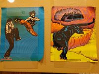 Two 16x20 vintage blacklight posters shown under normal light. One poster depicts a Kung Fu fight, the other a black panther in a cave.