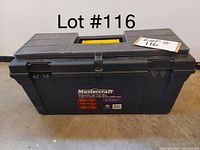 Closed view of black Mastercraft tool box with yellow handle and broken clasps.