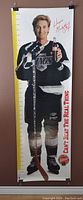 Full length photo of life size Wayne Gretzky growth chart in hockey uniform holding hockey stick and Coca-Cola bottle